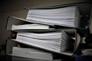 Pile of files with papers