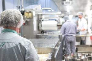 People cooking in commercial kitchen